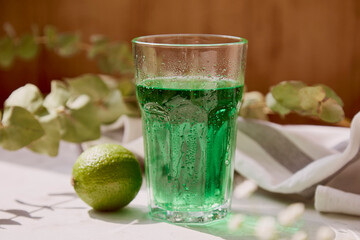 Non alcoholic healthy citrus lime green sparkling cocktail. Detox vitaminized healthy drink.