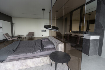 cool expensive interior design of room in prestigious luxury hotel with dark tones with modern LED...