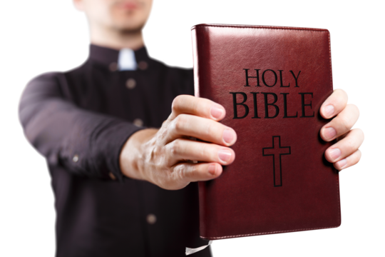 Priest holding the Holy Bible, cut out