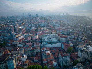 Obraz premium Galata Tower aerial view with morning twilight in Beyoglu district in historic city of Istanbul, Turkey. Historic Areas of Istanbul is a UNESCO World Heritage Site since 1985. 