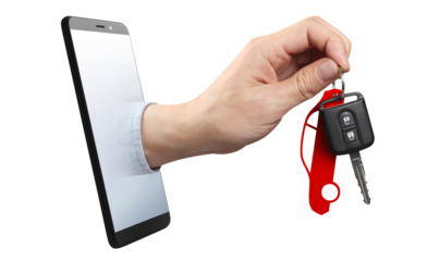 Hand holding a car key, sticking out of a smartphone screen, cut out