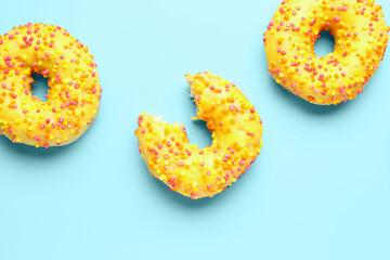 Sweet donuts on blue background