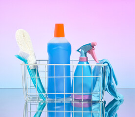 Basket with bottle of detergent and cleaners for cleaning home or office. Cleaning supplies.