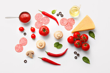 Fresh ingredients for preparing pizza on white background