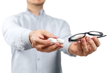 Male hands offering a choice between contact lens and eyeglasses, cut out