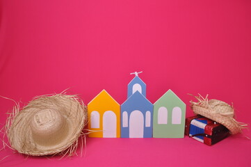cidade pequena cheia de casas coloridas gaita e chapéu de palha, fundo para promoção de festa...
