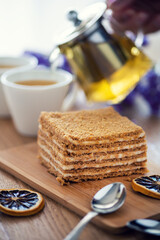 A piece of layered honey cake, tasty dessert, selective focus