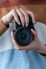 Photographers stand ready to work and In the photographer's hand there is a camera.