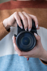 Photographers stand ready to work and In the photographer's hand there is a camera.