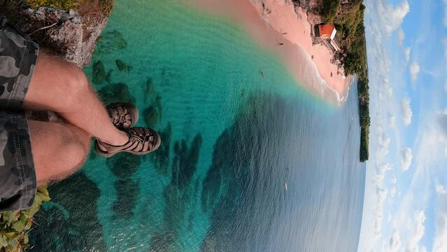 First Person View Travel People Enjoy Beautiful Beach Bali From The Top Mountain Cliff At Balangan Beach Bali Indonesia 4K