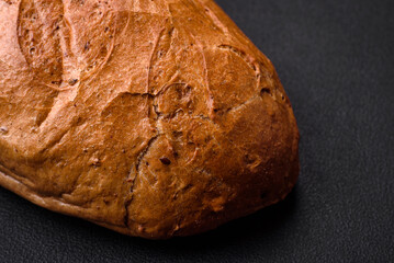 Delicious fresh crispy loaf of white bread with grains and seeds