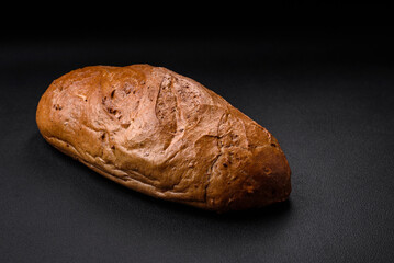Delicious fresh crispy loaf of white bread with grains and seeds