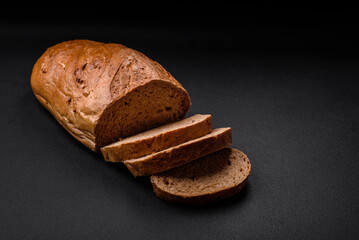 Delicious fresh crispy loaf of white bread with grains and seeds