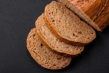 Delicious fresh crispy loaf of white bread with grains and seeds