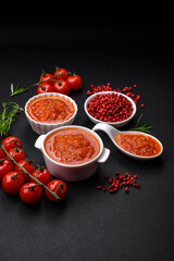 Delicious spicy tomato sauce with pepper, garlic, salt, spices and herbs