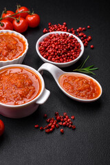 Delicious spicy tomato sauce with pepper, garlic, salt, spices and herbs