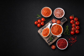 Delicious spicy tomato sauce with pepper, garlic, salt, spices and herbs