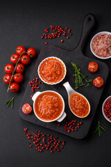 Delicious spicy tomato sauce with pepper, garlic, salt, spices and herbs