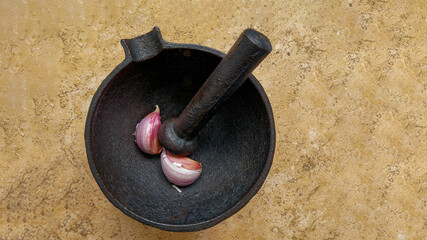 Metal mortar with garlic in the kitchen. 6