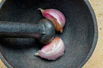 Metal mortar with garlic in the kitchen. 3