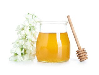 Jar of honey with flowers of acacia on white background