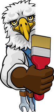 An eagle painter decorator cartoon animal mascot holding a paintbrush peeking around a sign