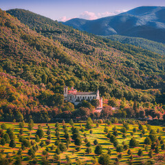 a church immersed in the woods of a mountain in Italy