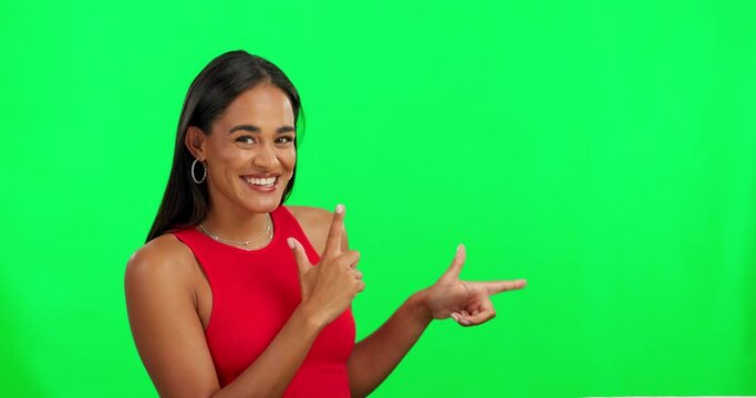 Happy woman, smile and pointing on green screen in advertising against a studio background. Portrait of excited female person and point in advertisement, sale discount or notification on mockup space