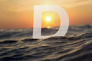 Discover a spellbinding sight as the letter "D" finds its aquatic home in the depths of the ocean. Bathed in a radiant underwater glow, this elegant symbol stands gracefully, embraced by vibrant Marin