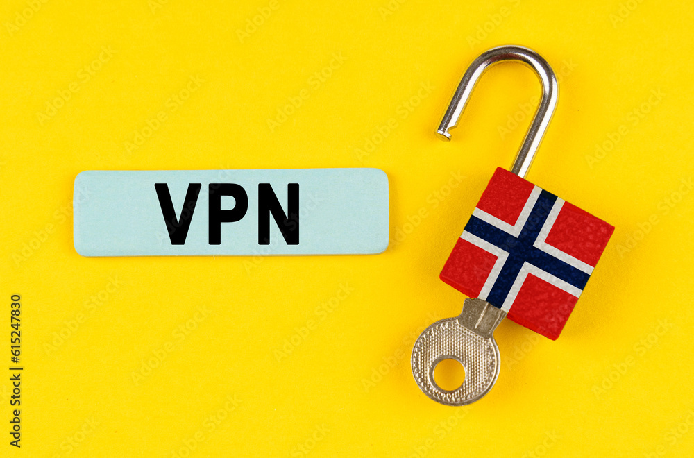 Poster on the yellow surface is an open lock with a key and a sticker with the inscription - vpn