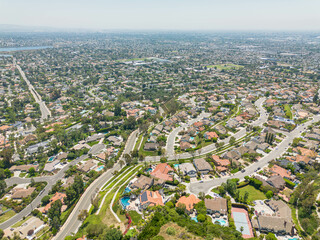 Orange, California - June 17, 2023: aerial drone photo view toward Orange in Orange County including Villa Park, Orange Hills, Meats Ave, Cannon St, Taft Ave

