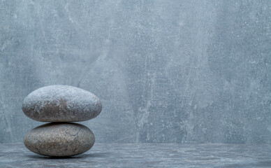minimalistic background with gray stones on a gray background for a podium background