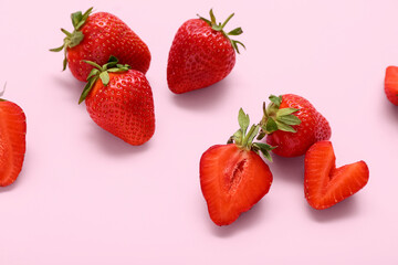 Fresh strawberries on pink background