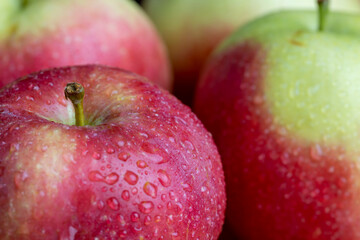 Fresh red and green apples on the kitchen table