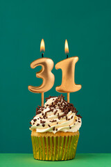 Birthday card with candle number 31 - Green background