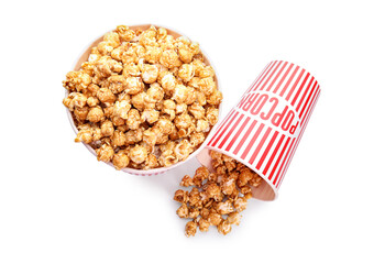 Buckets of tasty caramel popcorn isolated on white background