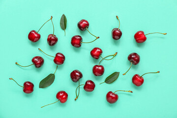 Many sweet cherries on turquoise background