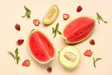 Pieces of fresh watermelon and different berries on orange background