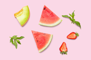 Pieces of fresh watermelon and different berries on pink background