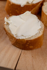 fresh soft cheese made from cow's milk spread on wheat bread