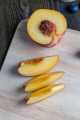 Ripe fresh peaches on a wooden table