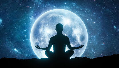 Woman silhouette sitting in yoga lotus pose against full blue Moon in the sky. Night sky landscape. Psychology and esoteric