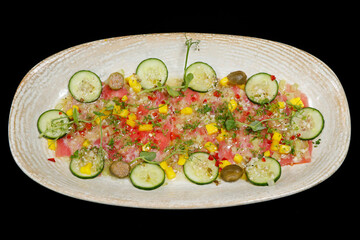 marinated yellowfin tuna crudo, similar to ceviche and tartare with lemon, cucumber, chili, mango and herbs