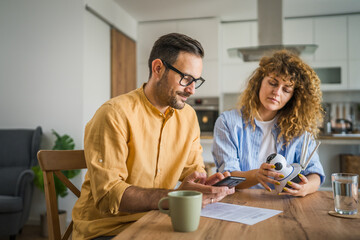 Couple at home connect and install cctv security surveillance camera