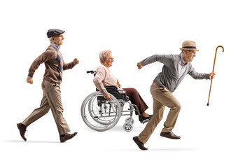 Senior men running and an elderly woman in a wheelchair