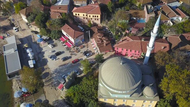 Golyazi Mosque. The settlement, formerly called Apolium, is literally a fishing village. There is a small mosque, market, restaurant and cafes on the edge of a lake. Aerial shot
