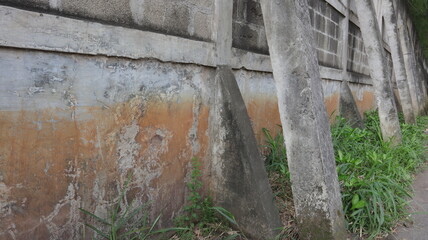 Concrete Wall with Buttresses Old Rough Textured Background