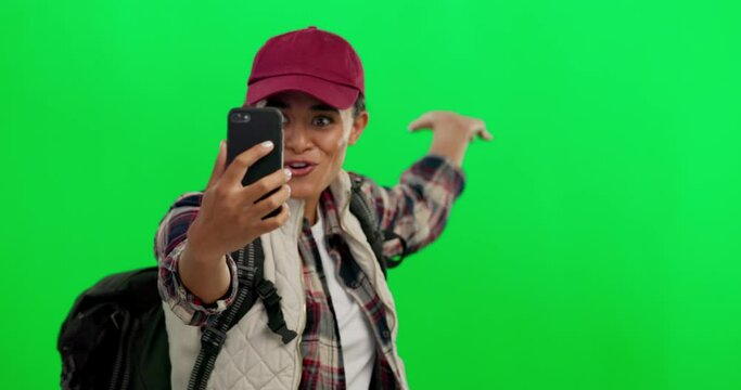 Green screen, selfie and influencer live streaming on social media for travel vlog isolated in a studio background. Online, backpack and woman on an adventure to explore with a phone on holiday