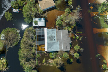 Heavy flood with high water surrounding residential houses after hurricane Ian rainfall in Florida...