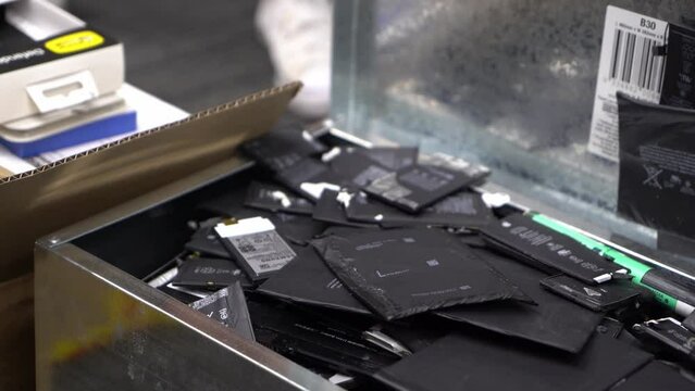 Panning Side To Side On Box Of Used Phone Batteries